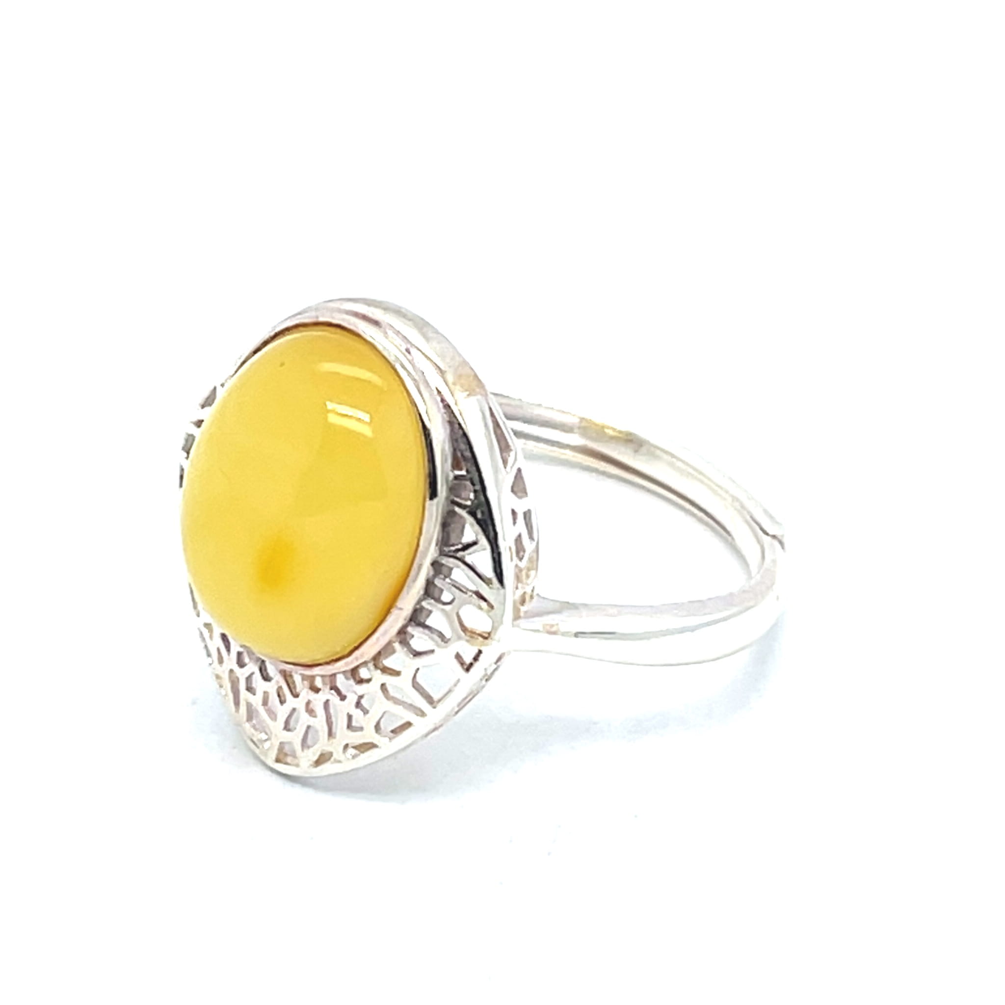 Regulowany pierścionek z miodowym bursztynem bałtyckim w srebrze 925.